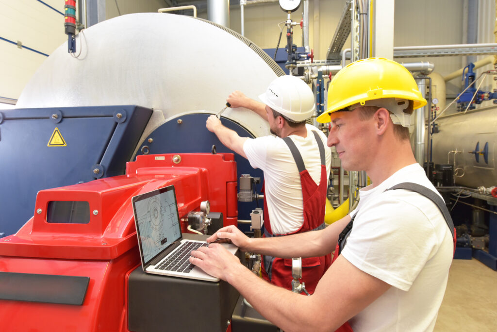 Mechanics Repair A Machine In A Modern Industrial Plant Profession And Teamwork
